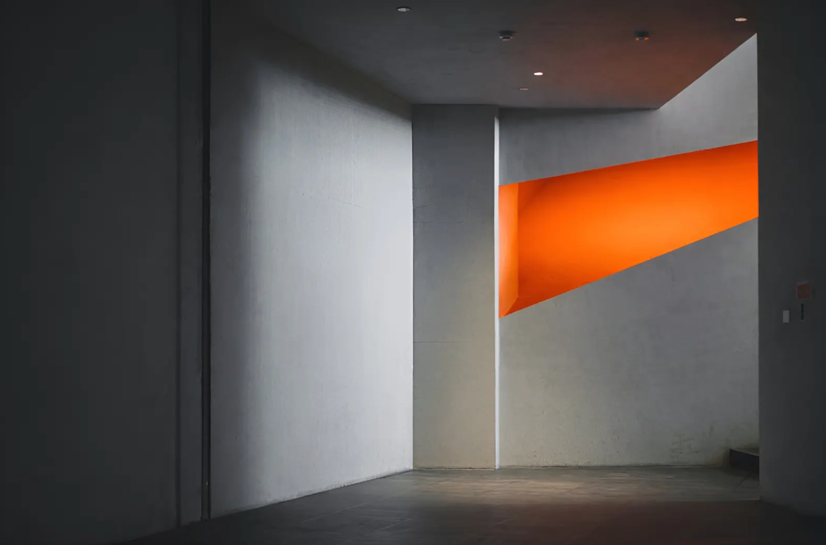 A developer pointing on a screen of a laptop with code.